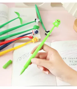 Detailed view of a cute dinosaur-topped gel pen being held over a gridded paper notebook