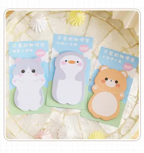 Detail of cute animal-shaped sticky notes featuring cat, penguin, and bear designs