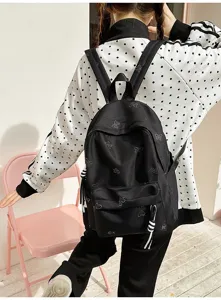Casual black backpack for daily school and travel featuring sparkling rhinestone butterfly details.