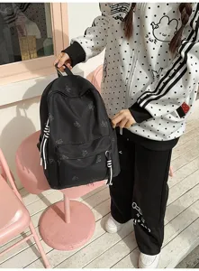 Casual black school backpack with cute butterfly patterns, large capacity for daily use and travel.