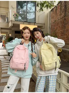 Detailed view of casual Japanese style butterfly print backpack, large capacity student school bag.