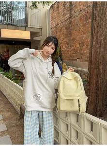 Casual yellow butterfly print backpack with large capacity, student school bag for daily use.