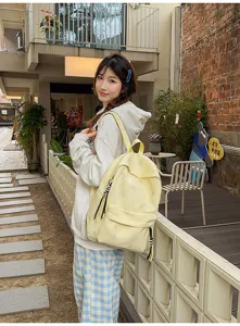 Casual Japanese style student backpack, light yellow daypack with butterfly print for daily use.