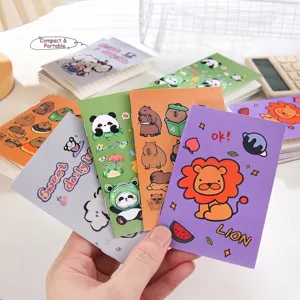 Set of colorful cartoon mini notebooks with cute animal designs like lions and pandas