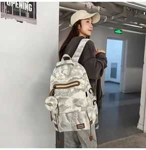 Sac à dos d'écolier ergonomique et élégant à grande capacité avec motif tendance sur modèle