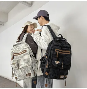 Vue détaillée de sacs à dos d'étudiants à grande capacité avec motifs de marbre noir et blanc