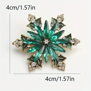 Détail d'une broche flocon de neige en cristal vert avec mesures de 4 cm sur 1,57 pouce