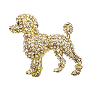 Élégante broche en forme de chien caniche dorée avec strass blancs étincelants et AB.
