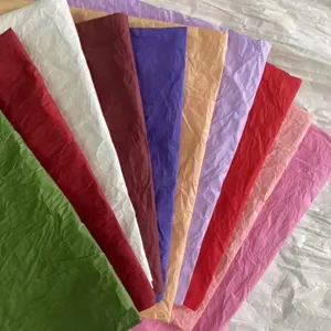Close-up of colorful textured hand-rubbed paper sheets for gift wrapping