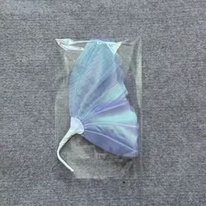 Macro detail of a colorful iridescent gauze butterfly decoration in clear packaging