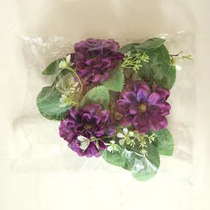 Purple artificial dahlia flower wreath in clear plastic bag for wedding decoration