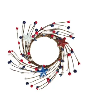 Patriotic berry wreath detail featuring red white blue stars and twig base for holiday decor.