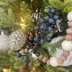 Blue artificial berry stem for festive Christmas tree decoration and handmade crafts