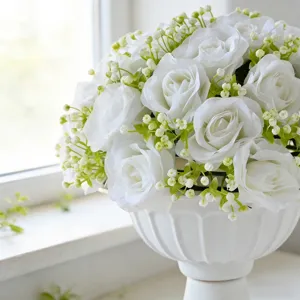 Elegant artificial white silk rose bouquet in a decorative pedestal vase for wedding decor
