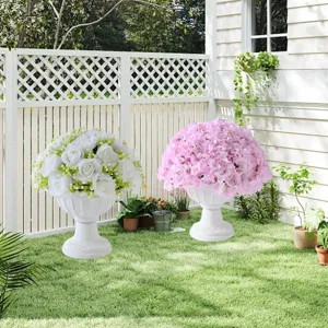 White and pink artificial hydrangea silk flowers with classical pedestal urns