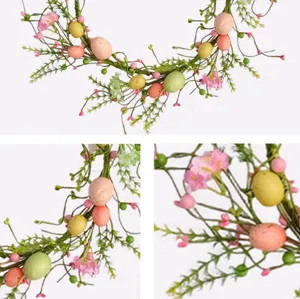 Close-up detail of artificial Easter vine with pastel eggs and pink floral berries