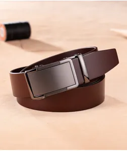 Close-up of premium brown leather belt with sleek metallic automatic buckle detail
