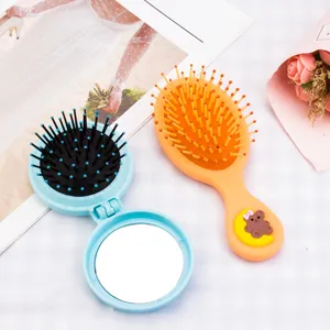 Portable folding air cushion hair brush set with cute cartoon bear design for daily use.