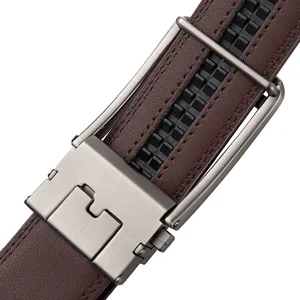 Close-up of automatic buckle mechanism and ratchet track on a brown leather belt.