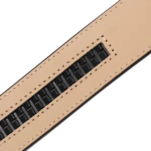 Detailed macro shot showing the black ratchet track on a tan leather belt interior