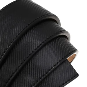 Close-up of black textured men's automatic belt strap with precision stitching details