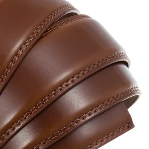 Macro detail view of the fine stitching and premium texture on a brown leather belt strap.