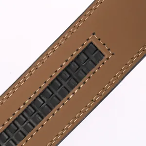 Detail of brown leather belt with black automatic ratchet track and fine stitching
