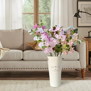 Artificial hydrangea flowers bouquet in white metal vase for living room home decor detail view