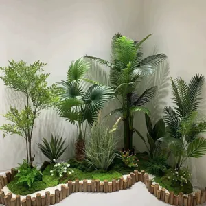 Detailed view of artificial moss landscaping with various fake plants and wooden fence