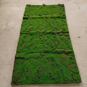Close-up of a vibrant green rectangular artificial moss mat for wall landscaping decoration