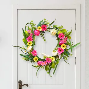 Detailed view of spring wild flower and wheat ear wreath for home door window decor.