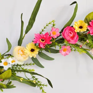 Spring wildflower garland detail close up, colorful artificial floral wreath for home decor.