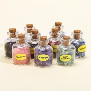 Collection of assorted natural crystal crushed stone specimens in small wishing bottles