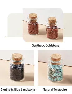 Detailed view of healing crystal gemstone chips in glass wishing bottles with cork stoppers.