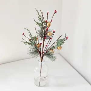 Decorative artificial pine needles and red berries branch for Christmas home decor