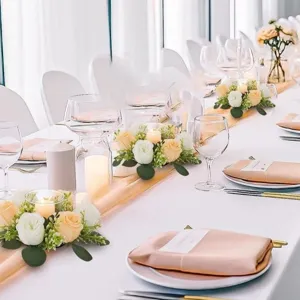 Artificial eucalyptus and rose candlestick wreath for wedding and party table decoration.