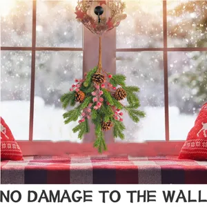 Festive Christmas pine cone hanging decoration with red berries for window wall decor