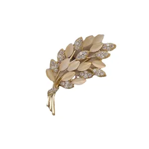 Elegant golden wheat ear brooch with sparkling crystals and opal-like stones