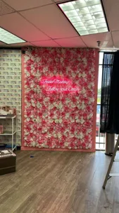Detailed view of large artificial pink and white rose flower wall for events and weddings