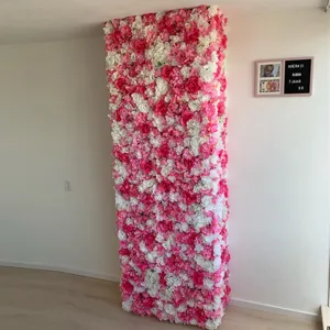 Detailed view of pink and white artificial flower wall decor in a home room setting