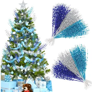 Detailed close-up showing glittery blue and silver berry picks for Christmas tree decoration
