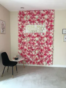 Large pink and white artificial flower wall backdrop for salon and wedding decor