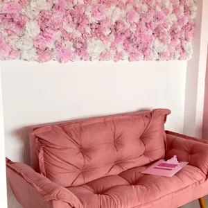Romantic pink and white artificial flower wall for wedding and event backdrop decoration.