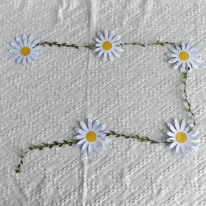 Paper daisy flower garland banner for birthday party wall decoration on white fabric