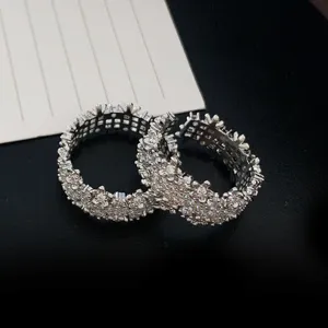 Detailed close-up view of a luxury silver iced out zircon ring with intricate metal lattice