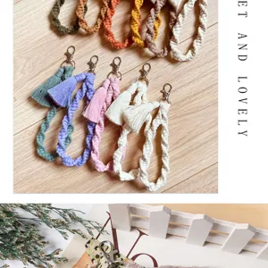 Handmade woven macrame wristlet keychain with colorful cotton rope, tassel and metal clasp.