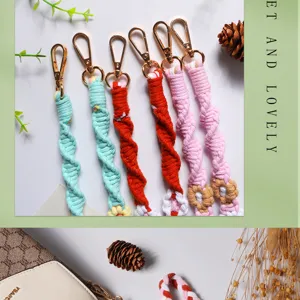 Detailed view of colorful Bohemian woven cotton flower phone straps with gold lobster clasps.