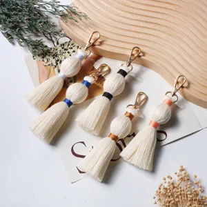 Handmade cotton woven tassel keychain bag charm, cute accessory for bags and keys, boho style.