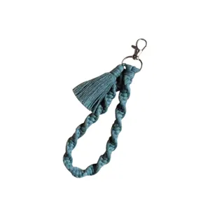 Handmade macrame cotton rope keychain wristlet with tassel and metal clasp for keys.