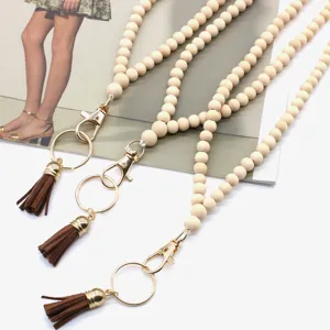 Boho style wooden bead lanyard necklace with brown tassel and gold key ring clasp